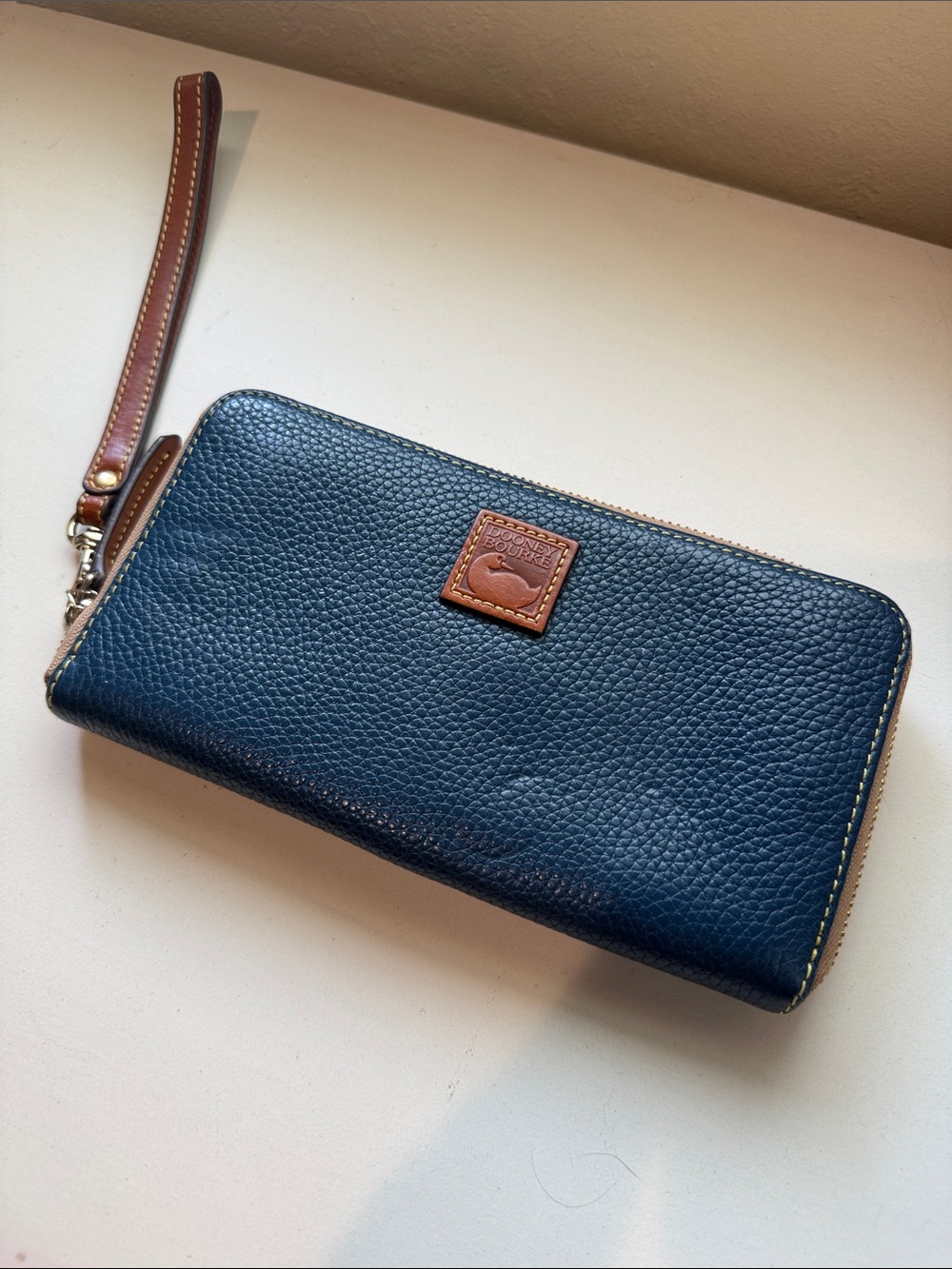 Dooney & Bourke Navy Pebble Leather Zip Wristlet with Tan Trim